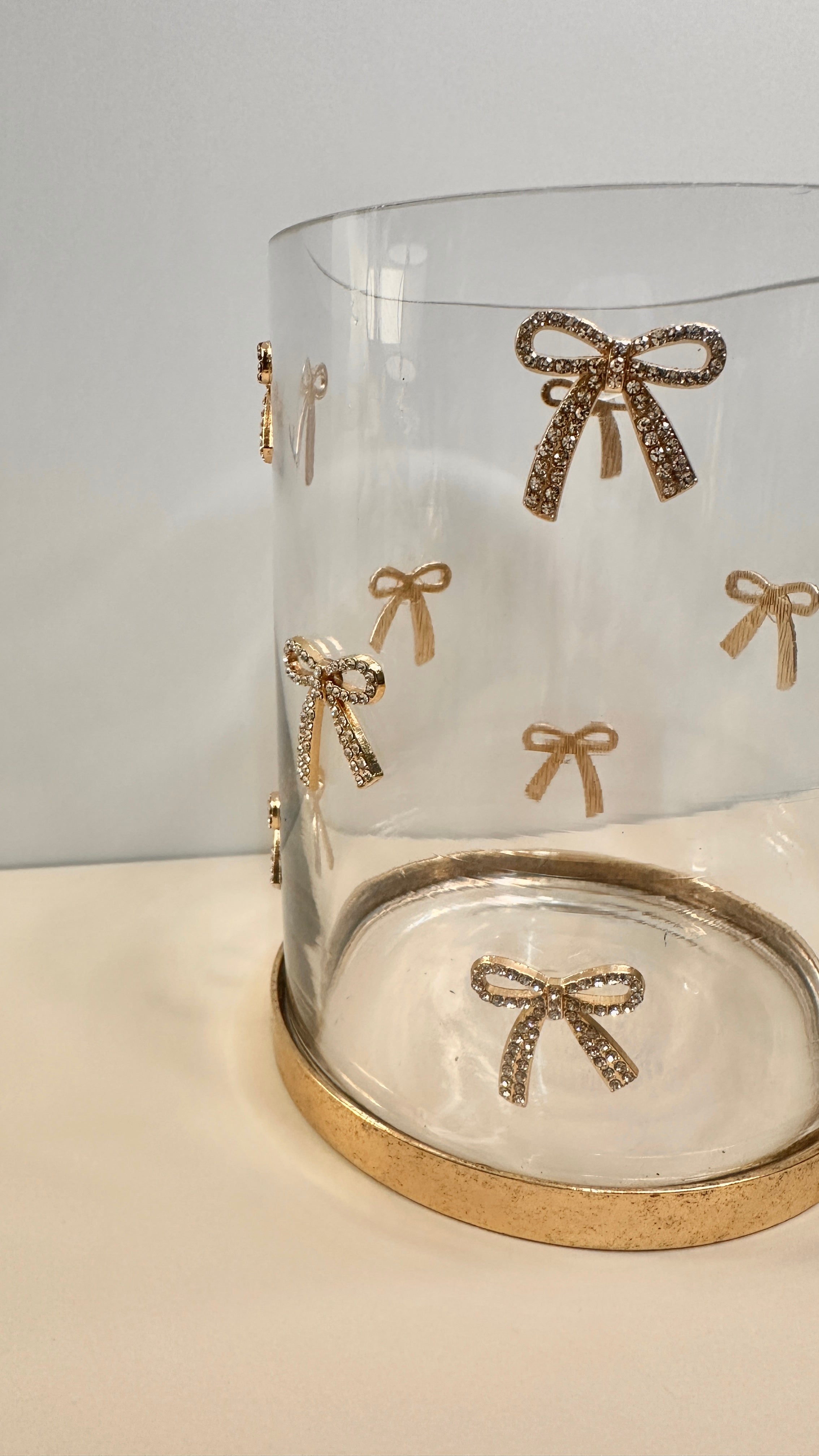 Decorative Glass Hurricane Candle Holder with Gold and Rhinestones Bow Pattern, Clear Cylinder with Metallic Base, 6" tall