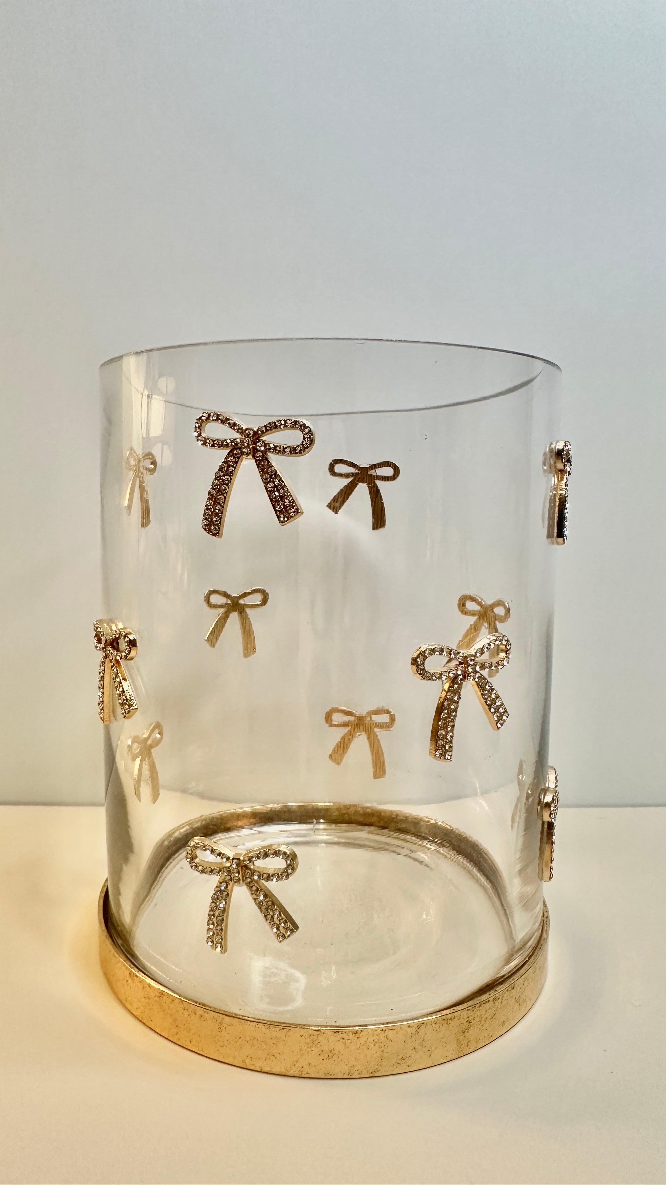 Decorative Glass Hurricane Candle Holder with Gold and Rhinestones Bow Pattern, Clear Cylinder with Metallic Base, 6" tall
